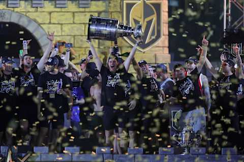 LAS VEGAS, NEVADA – JUNE 17: Brett Howden #21 of the Vegas Golden Knights hoists the Stanley Cup as he celebrates with teammates onstage during a victory parade and rally for the Golden Knights outside T-Mobile Arena on June 17, 2023, in Las Vegas, Nevada. The Golden Knights defeated the Florida Panthers four games to one to win the 2023 NHL Stanley Cup Final. (Photo by Ethan Miller/Getty Images)