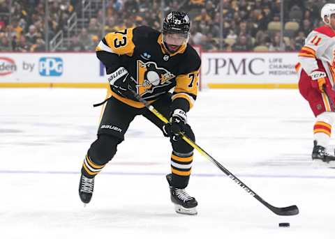 PITTSBURGH, PENNSYLVANIA – OCTOBER 14: Pierre-Olivier Joseph #73 of the Pittsburgh Penguins skates with the puck during the first period against the Calgary Flames at PPG PAINTS Arena on October 14, 2023 in Pittsburgh, Pennsylvania. (Photo by Jason Mowry/Getty Images)