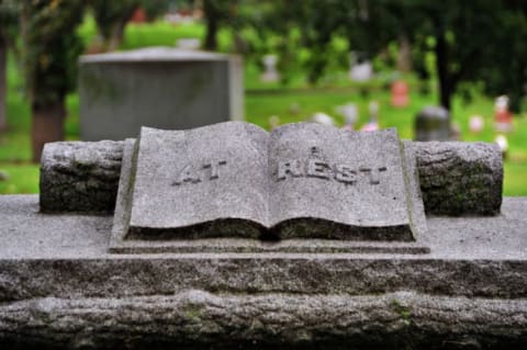 The meaning of a book on a tombstone isn't always easy to read.