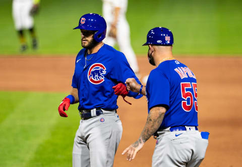 Apr 10, 2021; Pittsburgh, Pennsylvania, USA; Chicago Cubs second baseman David Bote (13) is greeted by Chicago Cubs quality assurance coach Mike Napoli (55) against the Pittsburgh Pirates during the sixth inning at PNC Park. Mandatory Credit: Mark Alberti-USA TODAY Sports