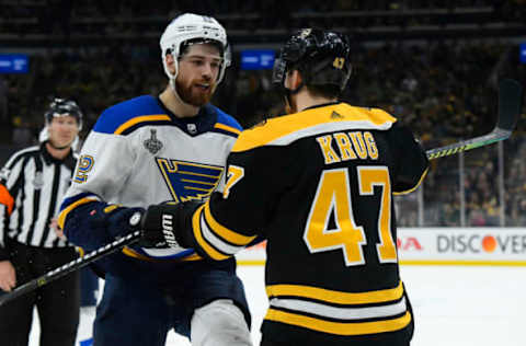 BOSTON, MA – JUNE 6: Torey Krug #47 of the Boston Bruins exchanges words with Zach Sanford #12 of the St Louis Blues during Game Five of the 2019 NHL Stanley Cup Final at the TD Garden on June 6, 2019 in Boston, Massachusetts. (Photo by Brian Babineau/NHLI via Getty Images)