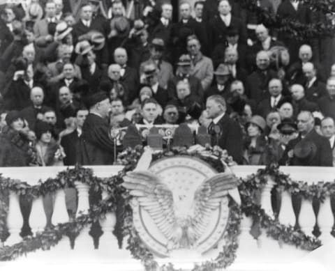 Chief Justice William H. Taft administering the oath of office to Herbert Hoover.