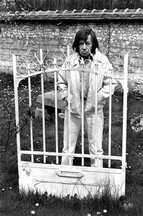 Patricia Highsmith poses in her garden during a portrait session held on April 21, 1978 in Grez sur Loing, France.