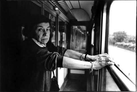 Patricia Highsmith poses on a train from Locarno to Zurich in Switzerland in 1987.