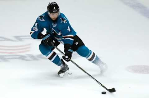 Feb 19, 2017; San Jose, CA, USA; San Jose Sharks defenseman Brenden Dillon (4) controls the puck during the second period of the game against the Boston Bruins at the SAP Center in San Jose. Mandatory Credit: Stan Szeto-USA TODAY Sports