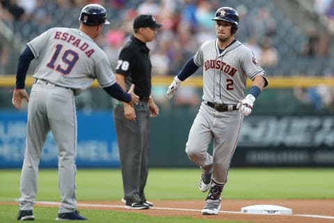 DENVER, COLORADO – JULY 03: Alex Bregman #2 of the Houston Astros is congratulated by third base coach Joe Espada #19 as he circles the bases after hitting a solo home run in the first inning against the Colorado Rockies at Coors Field on July 03, 2019 in Denver, Colorado. (Photo by Matthew Stockman/Getty Images)