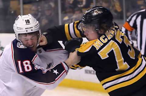 BOSTON – DECEMBER 18: Boston Bruins defenseman Charlie McAvoy (73) lands a punch on Columbus Blue Jackets center Pierre-Luc Dubois (18) face during the third period. The Boston Bruins host the Columbus Blue Jackets in a regular season NHL hockey game at TD Garden in Boston on Dec. 18, 2017. (Photo by Matthew J. Lee/The Boston Globe via Getty Images)