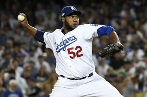 Oct 20, 2016; Los Angeles, CA, USA; Los Angeles Dodgers relief pitcher Pedro Baez (52) delivers a pitch in the eighth inning against the Chicago Cubs in game five of the 2016 NLCS playoff baseball series against the Los Angeles Dodgers at Dodger Stadium. Mandatory Credit: Richard Mackson-USA TODAY Sports