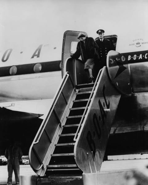 Princess Elizabeth and Prince Philip stepping out of an airplane upon their arrival in Montréal during their 1951 Royal tour of Canada.