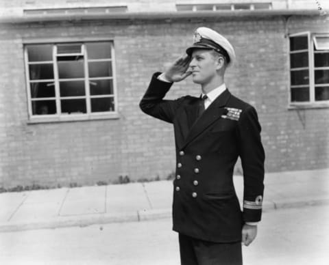 Lieutenant Philip Mountbatten, prior to his marriage to Princess Elizabeth, saluting as he resumes his attendance at the Royal Naval Officers School in 1947.