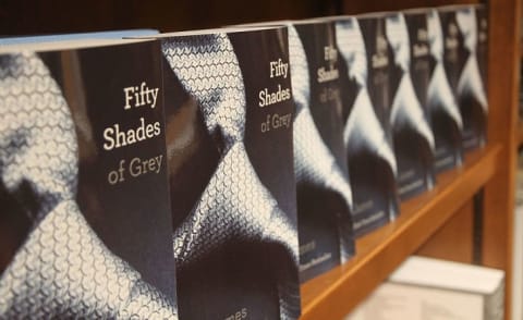 E.L. James greets fans and signs copies of her book Fifty Shades Of Grey at Books and Books in Coral Gables, Florida, in 2012.