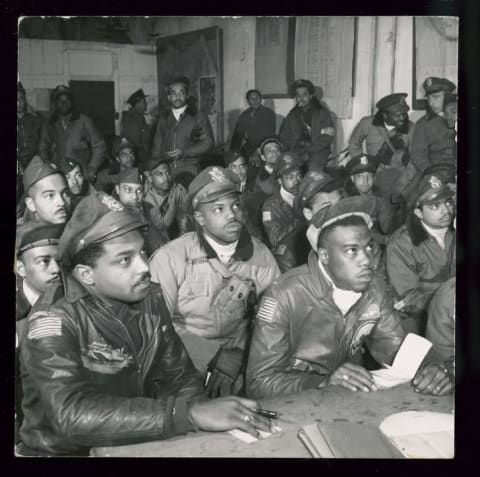 A group of Tuskegee Airmen attend a briefing in 1945.