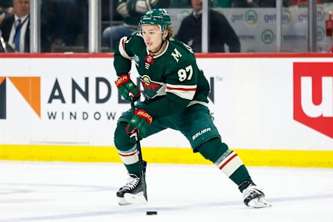 Kirill Kaprizov #97 of the Minnesota Wild skates with the puck against the Dallas Stars . (Photo by David Berding/Getty Images)