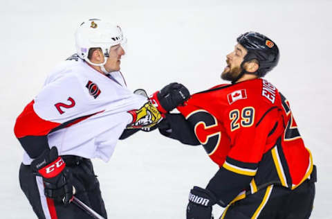 Oct 28, 2016; Calgary, Alberta, CAN; Ottawa Senators defenseman Dion Phaneuf (2) and Calgary Flames defenseman Deryk Engelland (29) exchanges words during the third period at Scotiabank Saddledome. Calgary Flames won 5-2. Mandatory Credit: Sergei Belski-USA TODAY Sports