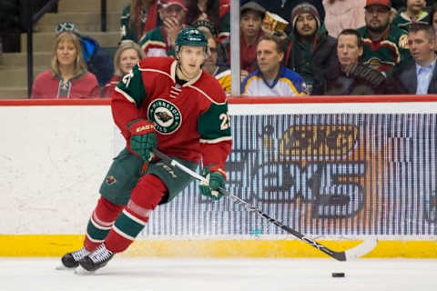 Jan 12, 2016; Saint Paul, MN, USA; Minnesota Wild defenseman Jonas Brodin (25) skates with the puck in the second period against the Buffalo Sabres at Xcel Energy Center. Mandatory Credit: Brad Rempel-USA TODAY Sports