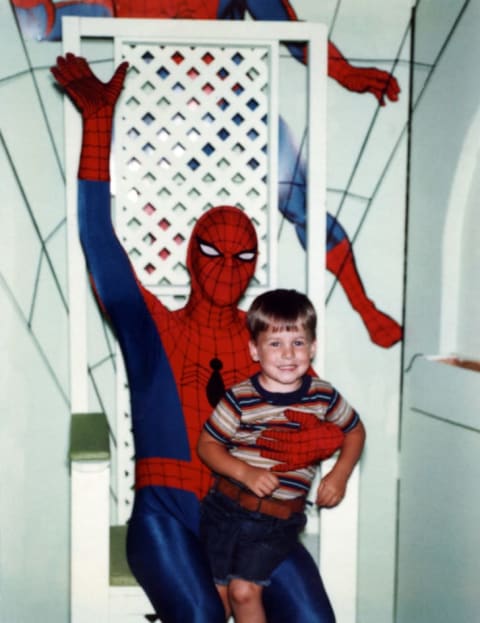 Kids lined up for a photo op with Spider-Man in the '80s. (Pictured is comic book writer Matt Fraction.)