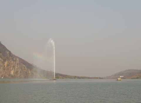 Water shooting from an artificial carbon dioxide vent in Lake Nyos in 2006.