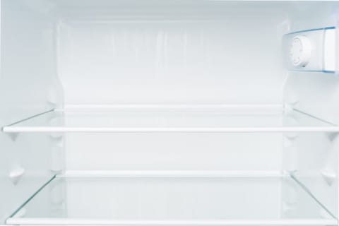 Refrigerator shelves can be hard to clean by hand.