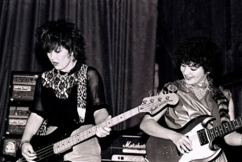 L to R: The Go-Go's Kathy Valentine and Jane Wiedlin perform at The Venue in London in 1981.