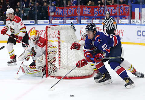 ST PETERSBURG, RUSSIA – JANUARY 9, 2018: Kunlun Red Star’s Joonas Jarvinen, goalie Magnus Hellberg (L-R) and SKA St Petersburg’s Yegor Rykov (R) in action in their 2017/18 KHL Regular Season ice hockey match at Ice Palace. Alexander Demianchuk/TASS (Photo by Alexander Demianchuk\TASS via Getty Images)