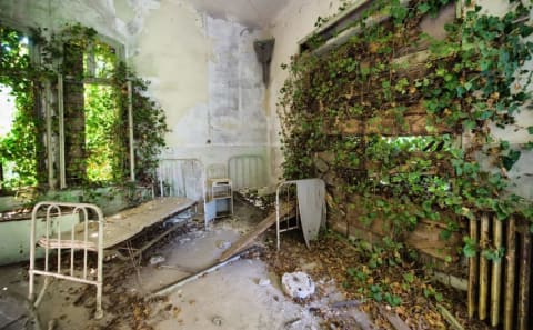 A dormitory in the psychiatric ward of the abandoned Hospital of Poveglia.