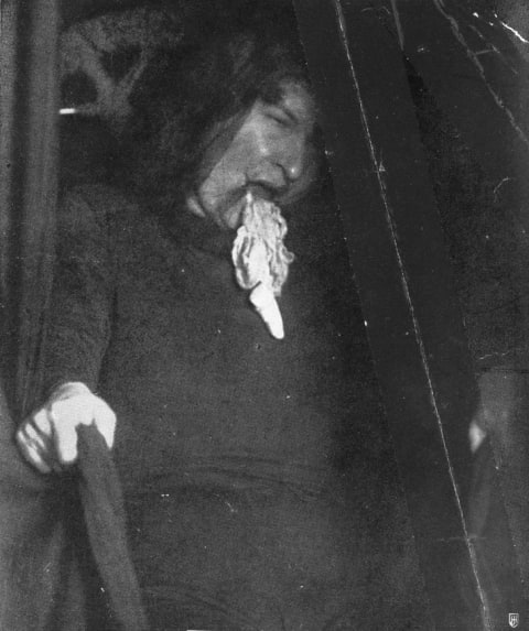 Ectoplasm emerging from the mouth of medium Marthe Beraud during a seance, circa 1910.