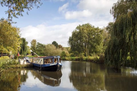 A narrowboat is moored near Stratford-upon-Avon in the UK.