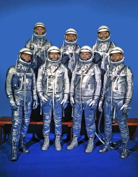 The Mercury 7 astronauts post for a group portrait. Front row (L-R) Walter M. "Wally" Schirra, Jr., Donald K. "Deke" Slayton, John H. Glenn, Jr., and M. Scott Carpenter; Back row (L-R) Alan B. Shepard, Jr., Virgil I. "Gus" Grissom and L. Gordon Cooper.