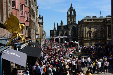 Tourists and Fringe performers alike fill Edinburgh's Royal Mile.