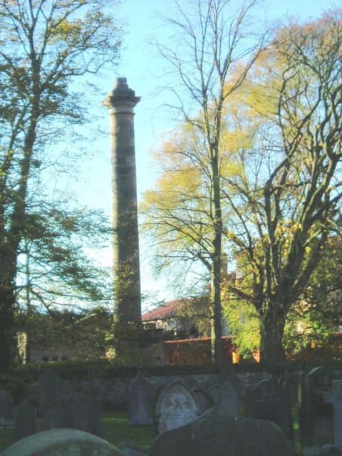 The column still looms over the cemetery.