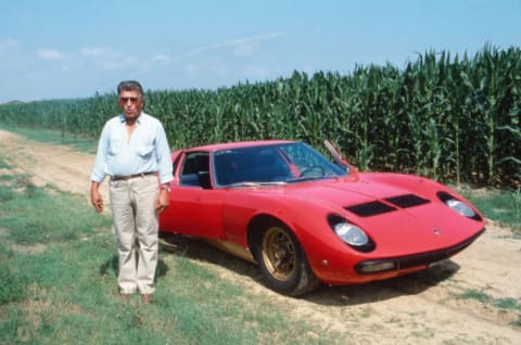 Ferruccio Lamborghini standing next to his namesake.