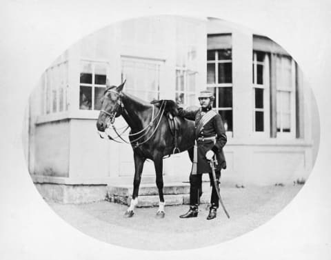 A British army cavalry soldier and his horse, circa 1875.