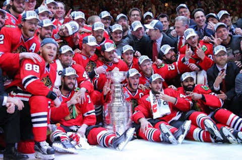 Jun 15, 2015; Chicago, IL, USA; Chicago Blackhawks players pose for a team photo with the Stanley Cup after defeating the Tampa Bay Lightning in game six of the 2015 Stanley Cup Final at United Center. Mandatory Credit: Dennis Wierzbicki-USA TODAY Sports