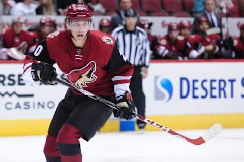 Oct 2, 2015; Glendale, AZ, USA; Arizona Coyotes center Dylan Strome (20) watches the puck during the second period against the San Jose Sharks at Gila River Arena. Mandatory Credit: Matt Kartozian-USA TODAY Sports