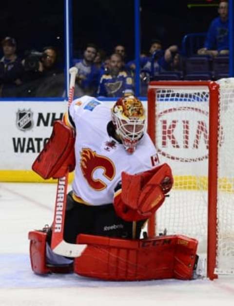 Oct 25, 2016; St. Louis, MO, USA; Calgary Flames goalie Brian Elliott (1) makes a glove save against the St. Louis Blues during the second period at Scottrade Center. Mandatory Credit: Jeff Curry-USA TODAY Sports