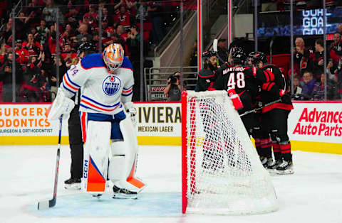 Nov 22, 2023; Raleigh, North Carolina, USA; Carolina Hurricanes right wing Jesper Fast (71) scores a goal past Edmonton Oilers goaltender Stuart Skinner (74) during the first period at PNC Arena. Mandatory Credit: James Guillory-USA TODAY Sports