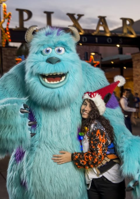 Alessia Cara posing with "fur character" Sully from Monsters, Inc.