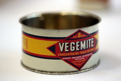 A vintage can of Vegemite on display.