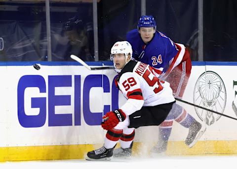 Janne Kuokkanen #59 of the New Jersey Devils skates against Kaapo Kakko #24 of the New York Rangers . (Photo by Bruce Bennett/Getty Images)