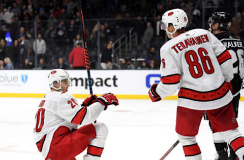 LOS ANGELES, CALIFORNIA – OCTOBER 15: Sebastian Aho #20 of the Carolina Hurricanes celebrate the empty net goal of Teuvo Teravainen #86 to take a 2-0 lead during the third period in a 2-0 Hurricanes win at Staples Center on October 15, 2019 in Los Angeles, California. (Photo by Harry How/Getty Images)