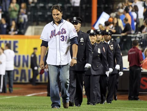 NEW YORK, NY – SEPTEMBER 11: Former New York Met Mike Piazza leads out first responders during ceremonies honoring the tenth anniversary of the September 11, 2001, terrorist attacks prior to the game between the New York Mets and Chicago Cubs at Citi Field on September 11, 2011, in the Flushing neighborhood of the Queens borough of New York City. (Photo by Jim McIsaac/Getty Images)