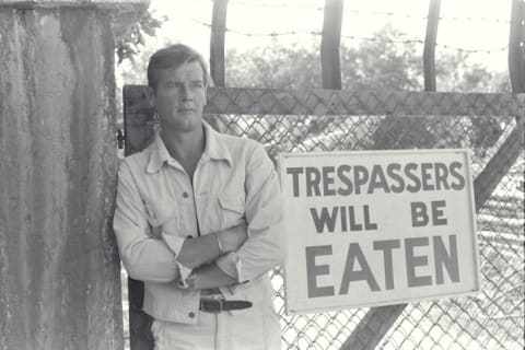 Roger Moore pictured on a crocodile farm outside New Orleans.