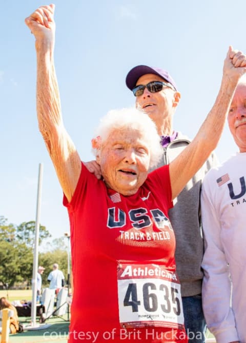 Julia 'Hurricane' Hawkins with her arms raised in victory.