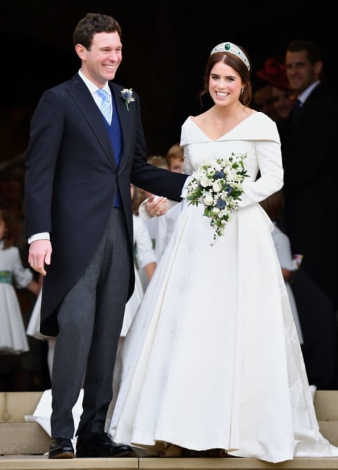 Jack Brooksbank and Princess Eugenie leave St. George's Chapel after their wedding ceremony on October 12, 2018 in Windsor, England.