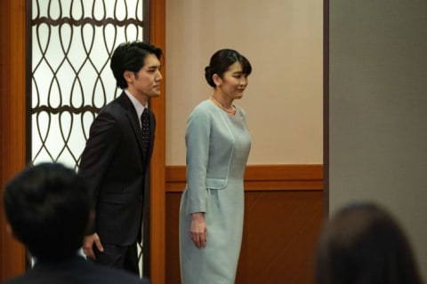 Princess Mako and her husband Kei Komuro leave a press conference after announcing their wedding.