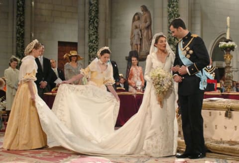 Spain's Crown Prince Felipe stands next to his bride Letizia Ortiz as they marry in Almudena cathedral on May 22, 2004 in Madrid.