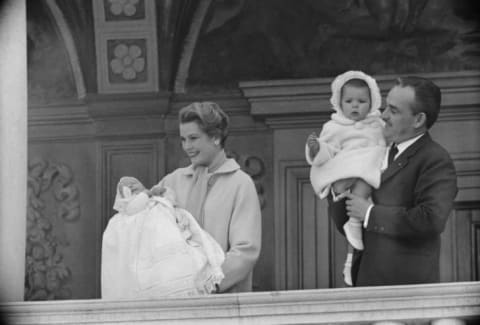 Prince Rainier of Monaco holds Princess Caroline while wife, Princess Grace, presents Prince Albert II from the balcony of the Palace of Monaco in 1958.