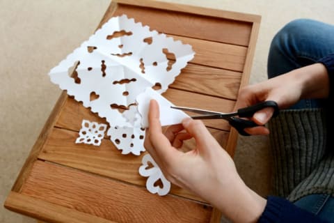 A well-formed triangle is key to making a good paper snowflake.