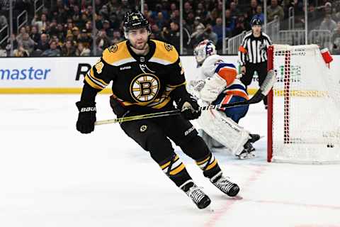 BOSTON, MASSACHUSETTS – DECEMBER 13: Jake DeBrusk #74 of the Boston Bruins skates away after scoring on Semyon Varlamov #40 of the New York Islanders during an overtime shootout against the New York Islanders at the TD Garden on December 13, 2022, in Boston, Massachusetts. (Photo by Brian Fluharty/Getty Images)