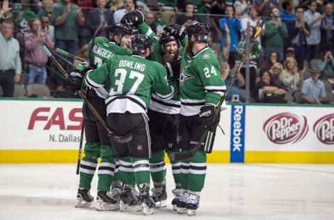 Oct 25, 2016; Dallas, TX, USA; d37 and defenseman John Klingberg (3) and defenseman Jordie Benn (24) and right wing Patrick Eaves (18) celebrate the goal by Eaves against Winnipeg Jets during the second period at the American Airlines Center. Mandatory Credit: Jerome Miron-USA TODAY Sports